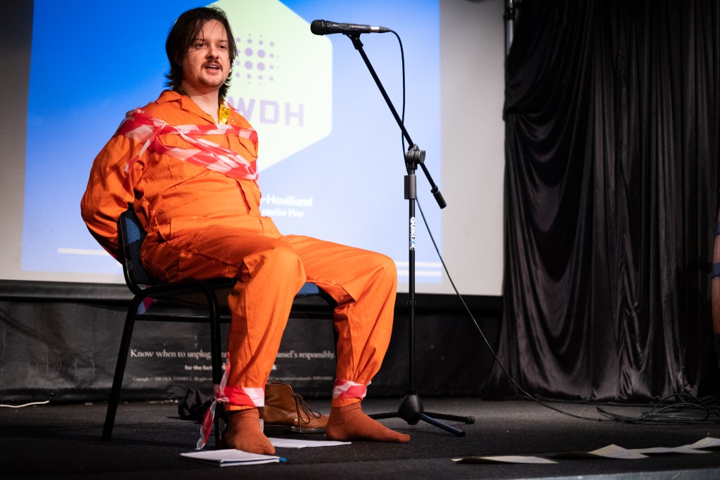 Alastair Bridge (Andy Barr) is released from government custody for one afternoon to share excerpts from his new book.